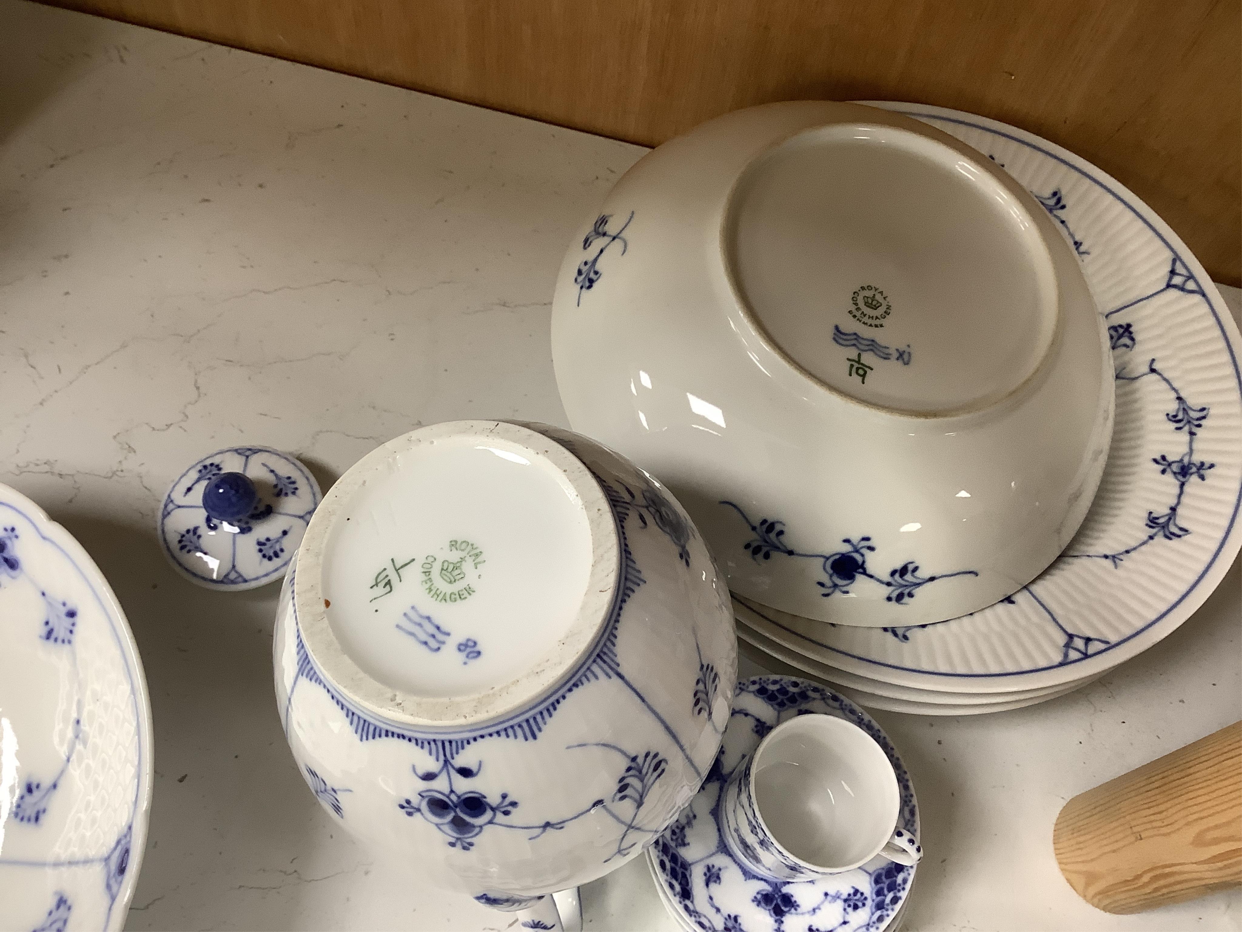 A collection of Royal Copenhagen and Bing & Grondahl onion pattern blue and white tableware